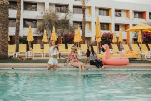 girls in pool with floaties